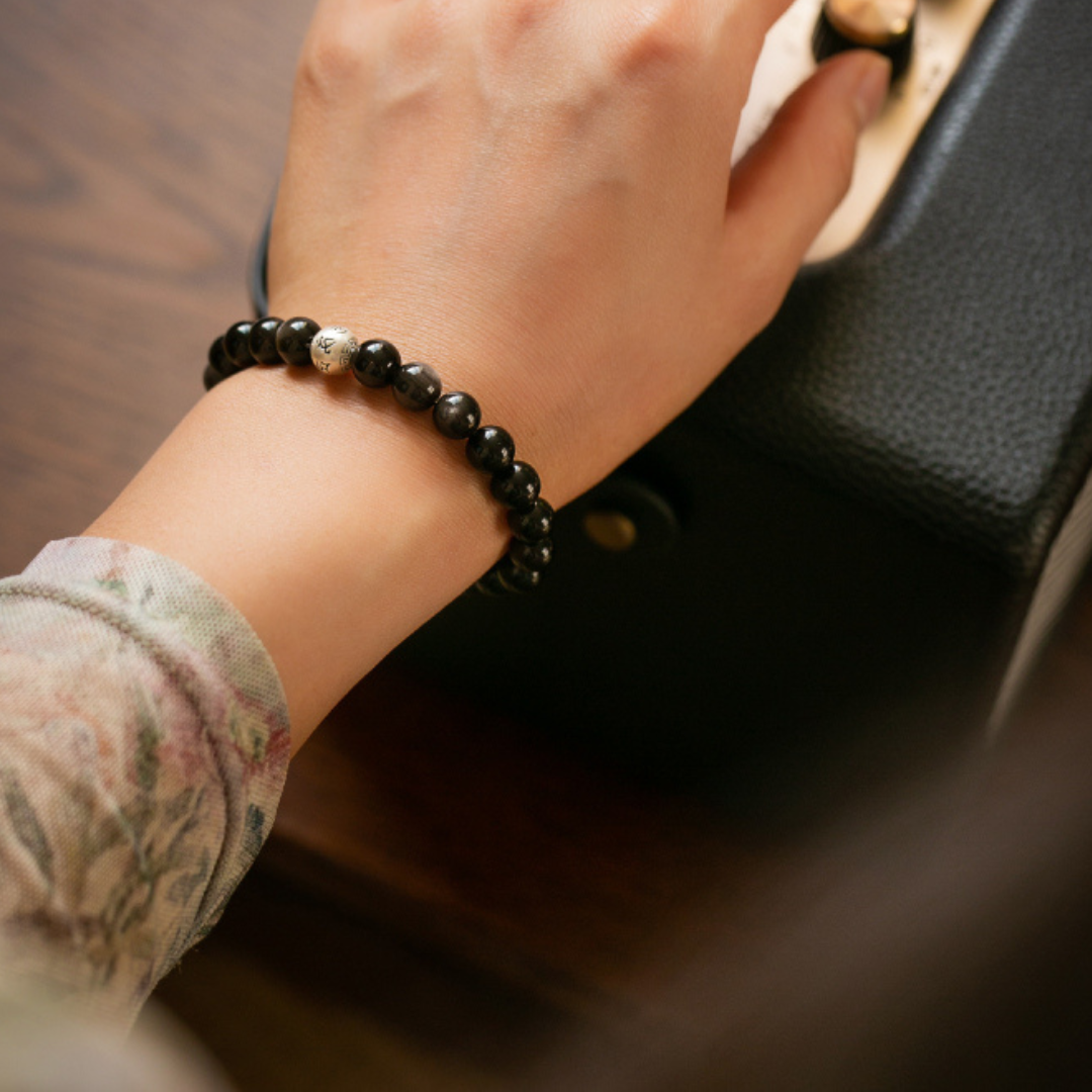 This silver obsidian bracelet allows you to bring your own protective barrier