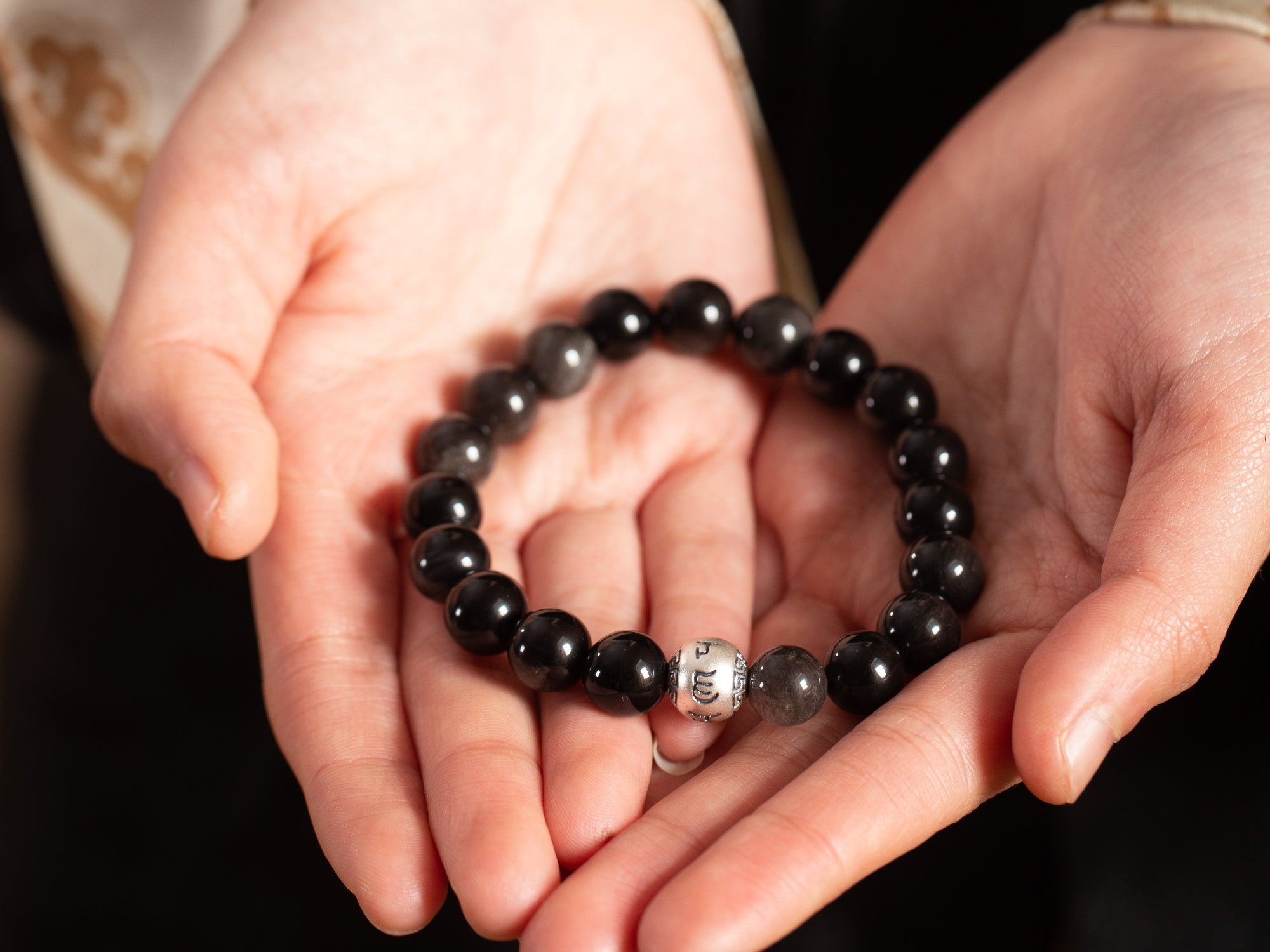 This silver obsidian bracelet allows you to bring your own protective barrier